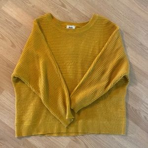 XL mustard colored knit sweater with brown button on the back.